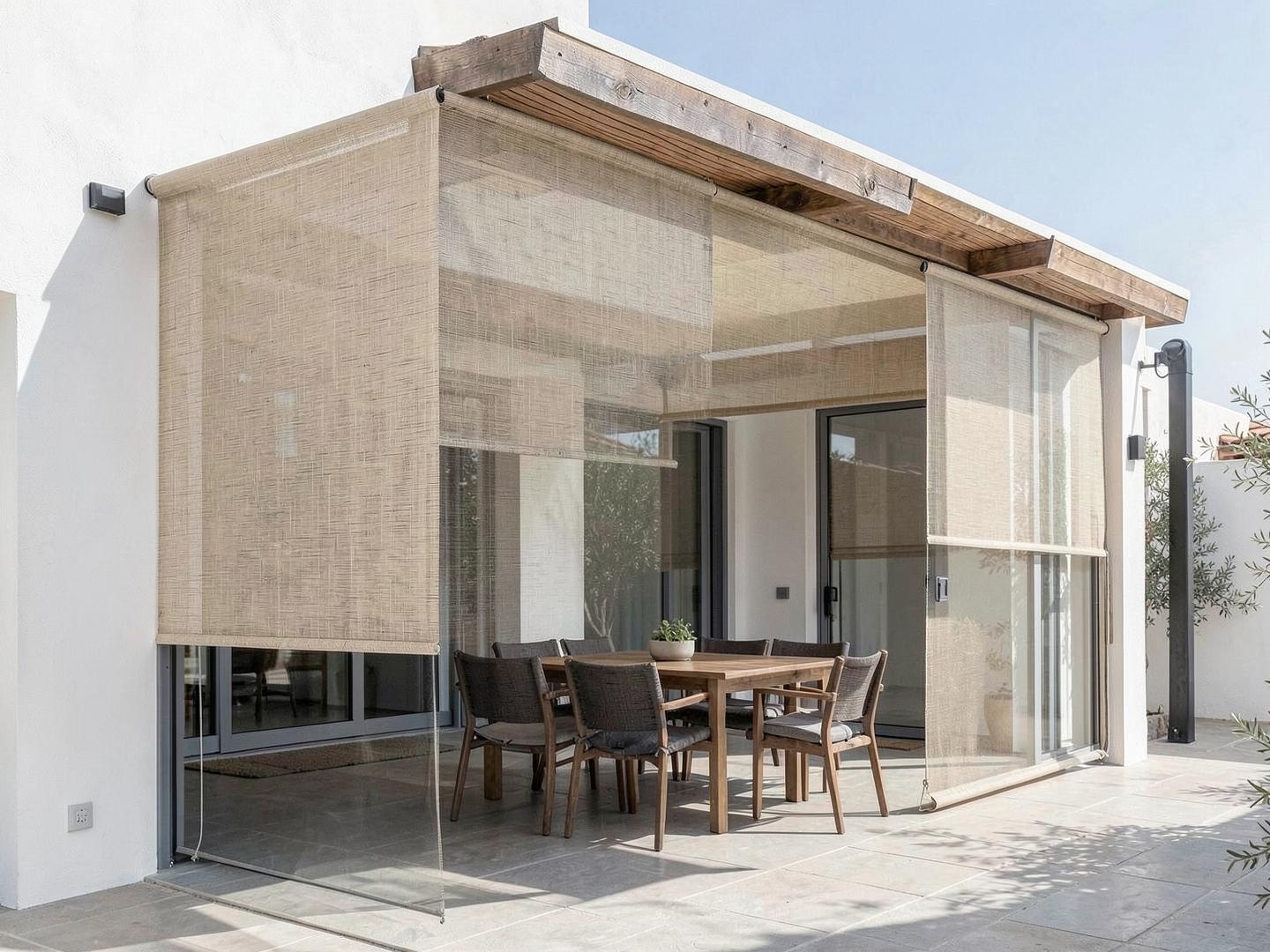 Woven zip screens surrounding a shaded dining terrace